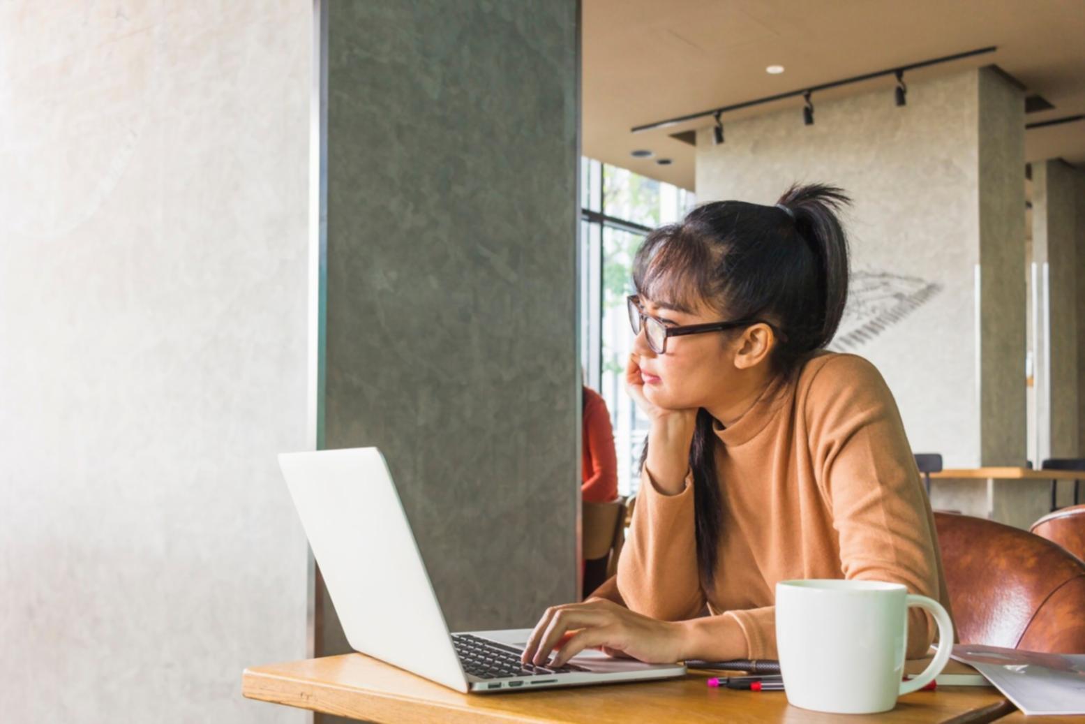 Financial analyst workspace with research materials and analytical tools